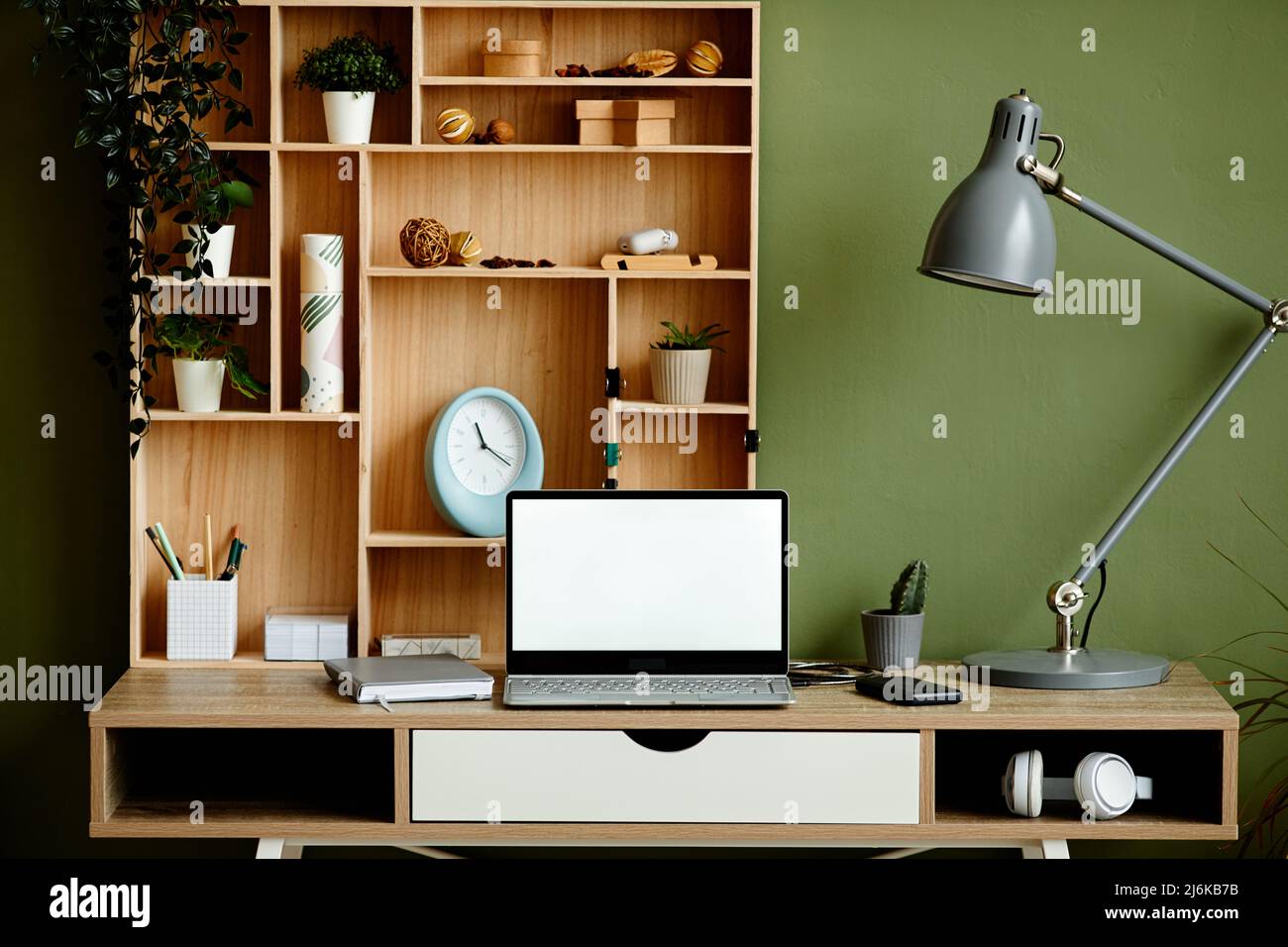 Front view background image of cozy home office workplace decorated by