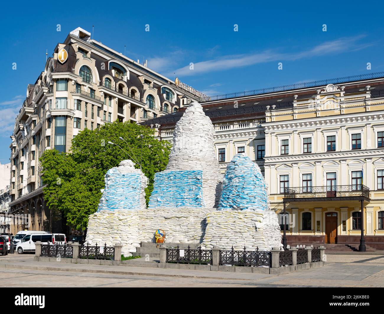 The monument to Princess Olga, Kyiv, Mykhailivska square, is covered with sandbags painted in blue and yellow, protective structure aganst Russian mis Stock Photo