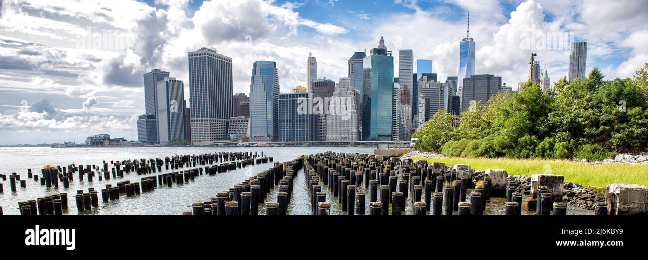 New York City Skyline panoramic banner showing Midtown and Lower Manhattan from the Brooklyn Bridge Park Pier 1 salt marsh. Iconic New York and famous Stock Photo