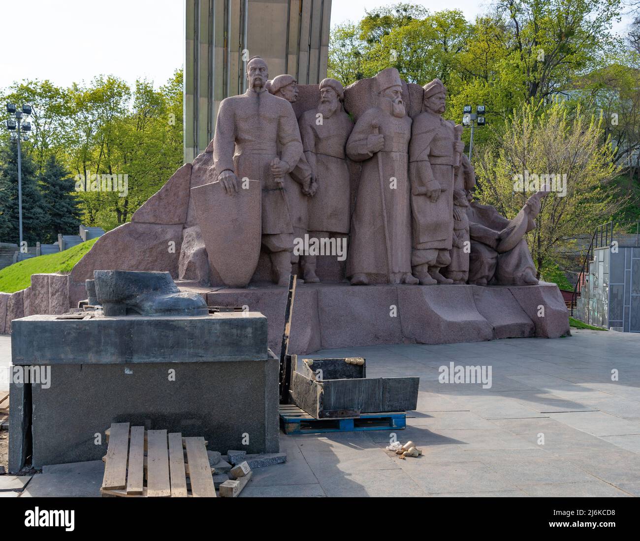 Partially destroyed monument near Arch of friendship of peoples Kyiv Ukraine war Stock Photo