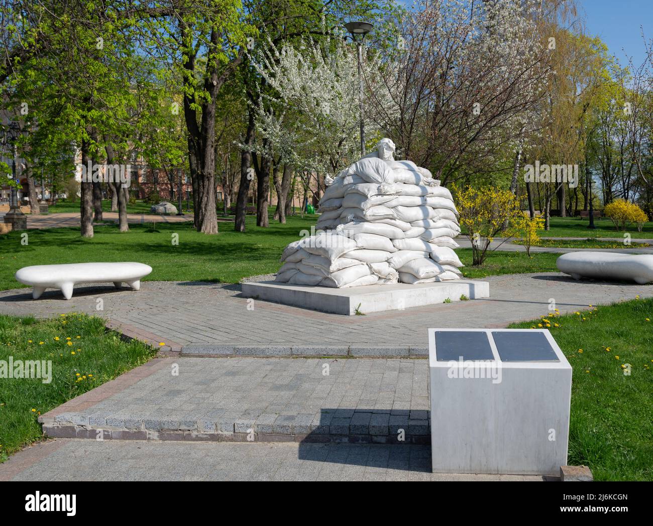 Monument to Dante Alighieri protected by sandbags from Russian missile during war Kyiv Volodymyrska Hill Stock Photo