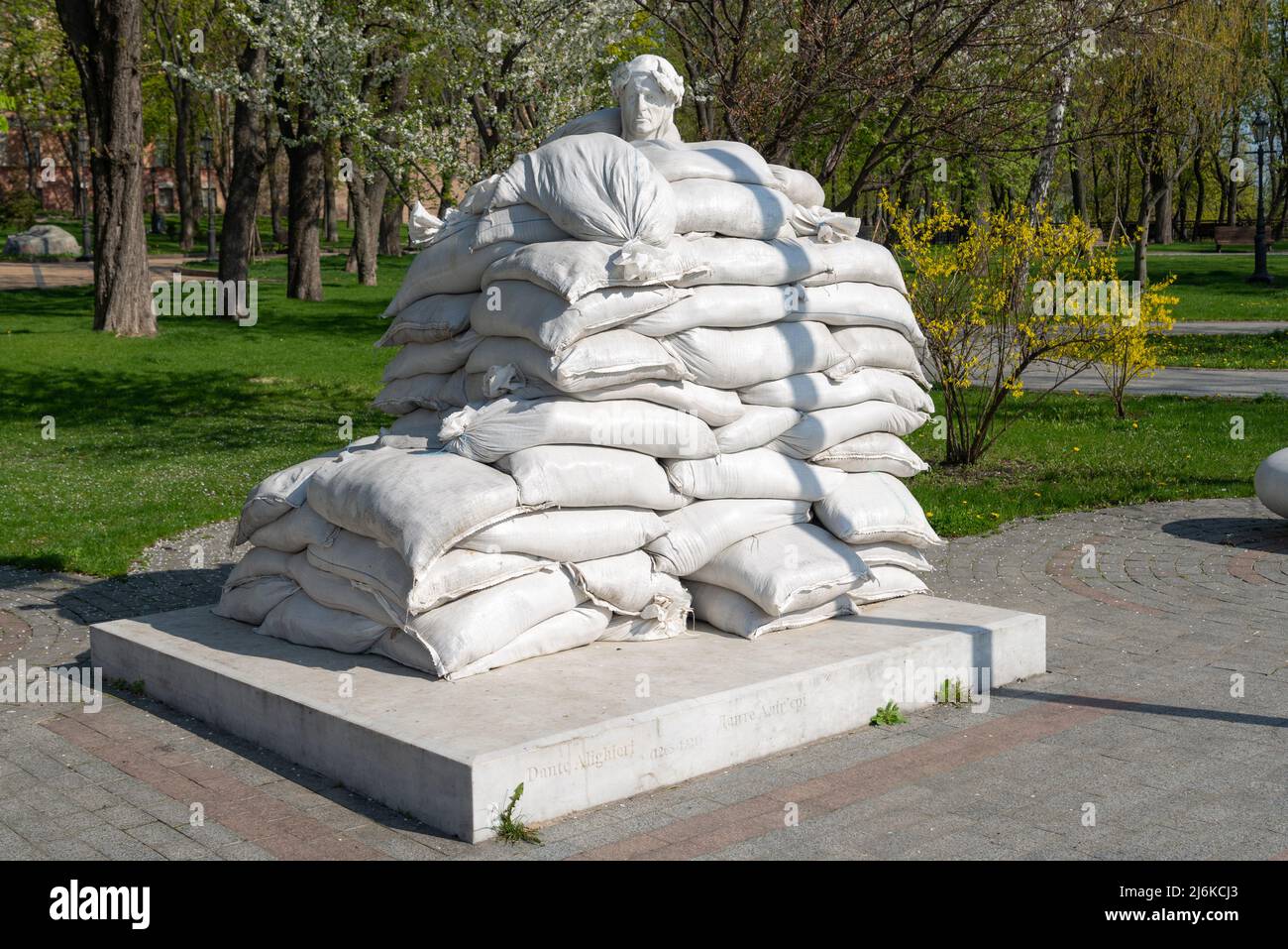 Monument to Dante Alighieri protected by sandbags from Russian missile during war Kyiv Volodymyrska Hill Stock Photo