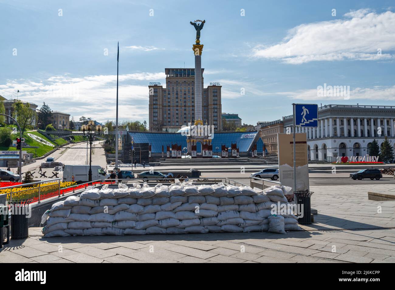 Independence Square Kyiv with protection by sandbags red flowers monuments springtime Stock Photo