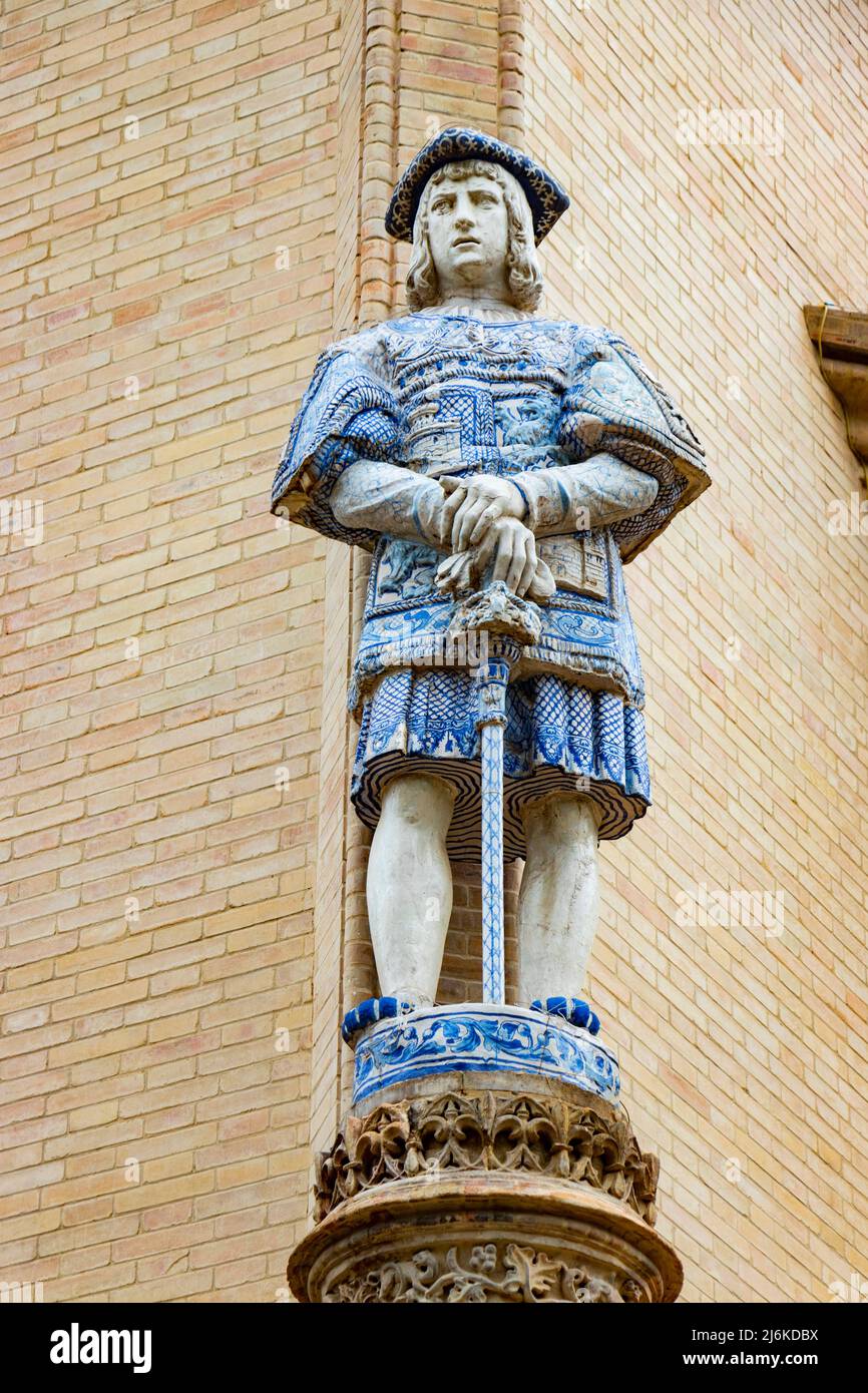 statue of soldier with ceramic decoration on the Pabellón Real in Seville Sevilla Spain now government offices Stock Photo