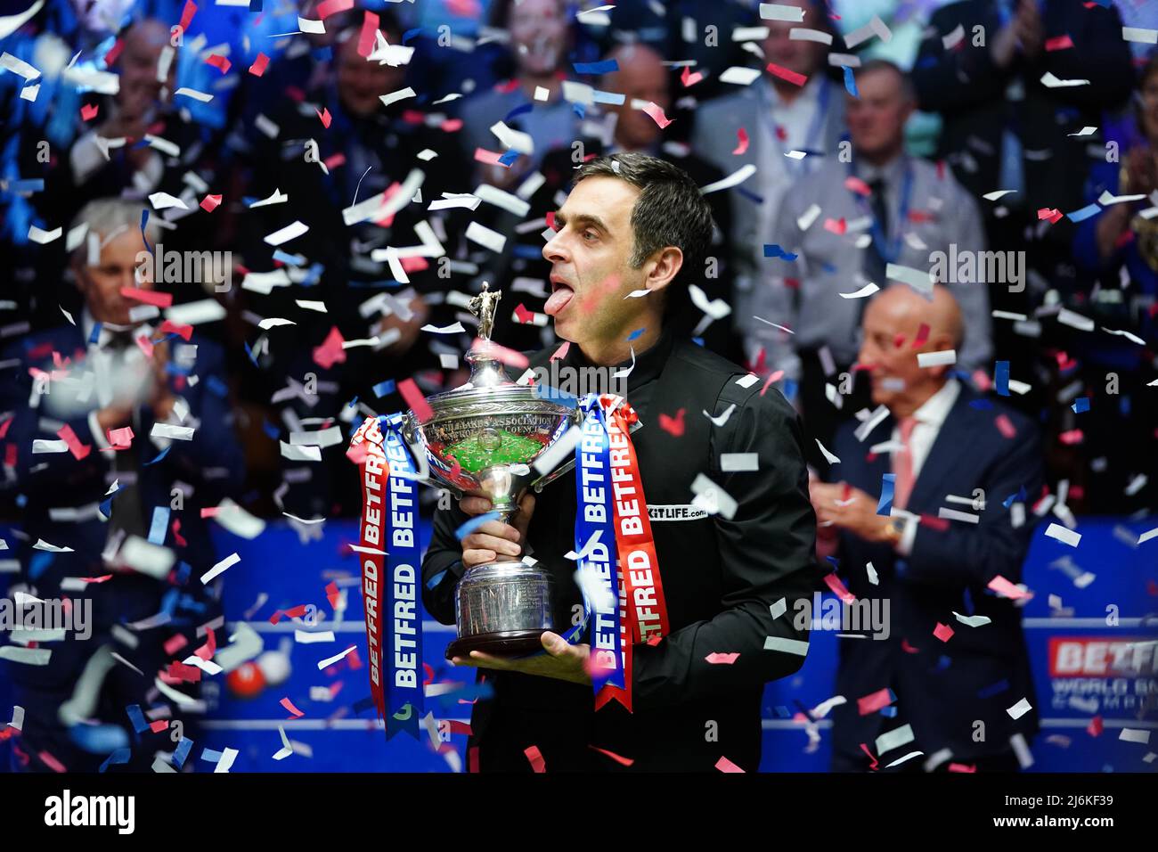 Ronnie O'Sullivan celebrating trophy Brecel's Resilience and the Rise of a New Generation