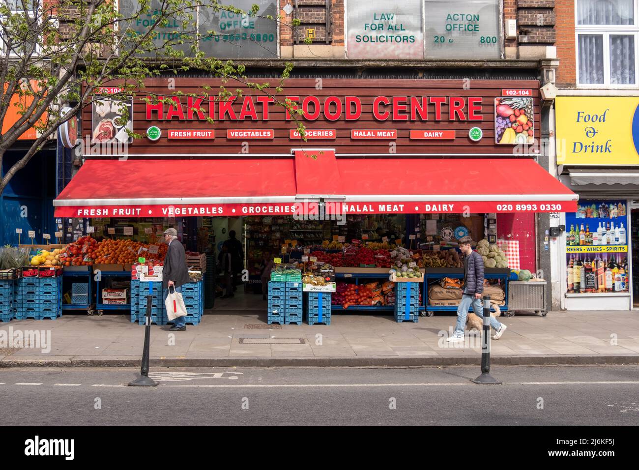 London- April 2022: An independent grocers shop on Acton high street, Stock Photo