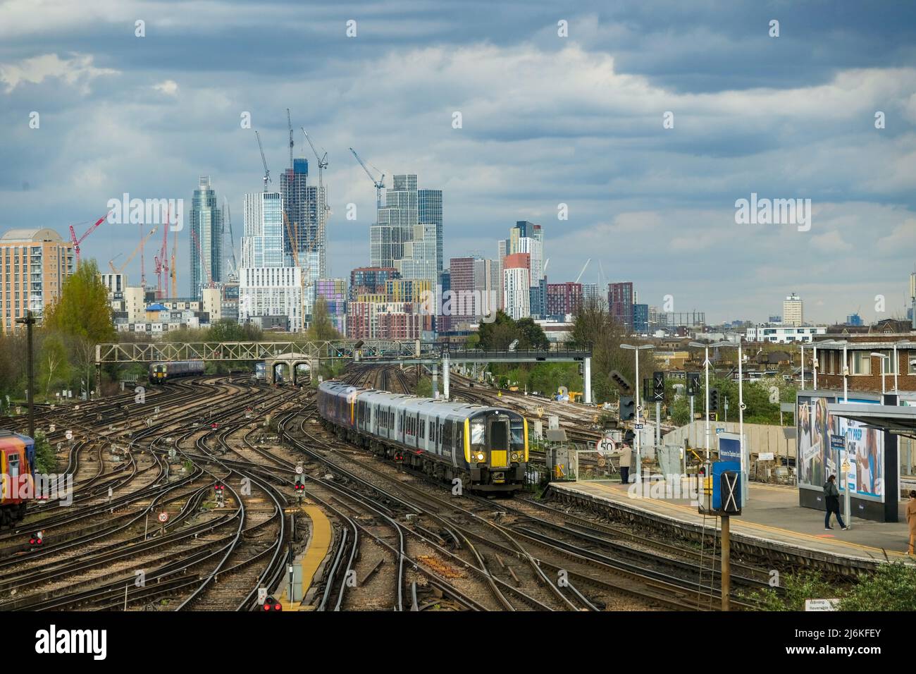 London- April 2022: Trains and many railway tracks of Clapham Junction railway station in south west London Stock Photo