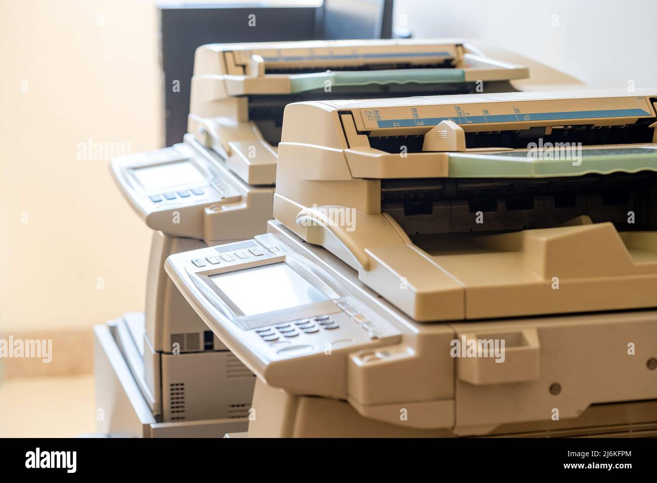 Copy shop copiers, photocopying point interior, two photocopiers copy machines objects closeup, detail, nobody. Photocopy archiving, scanning copying Stock Photo