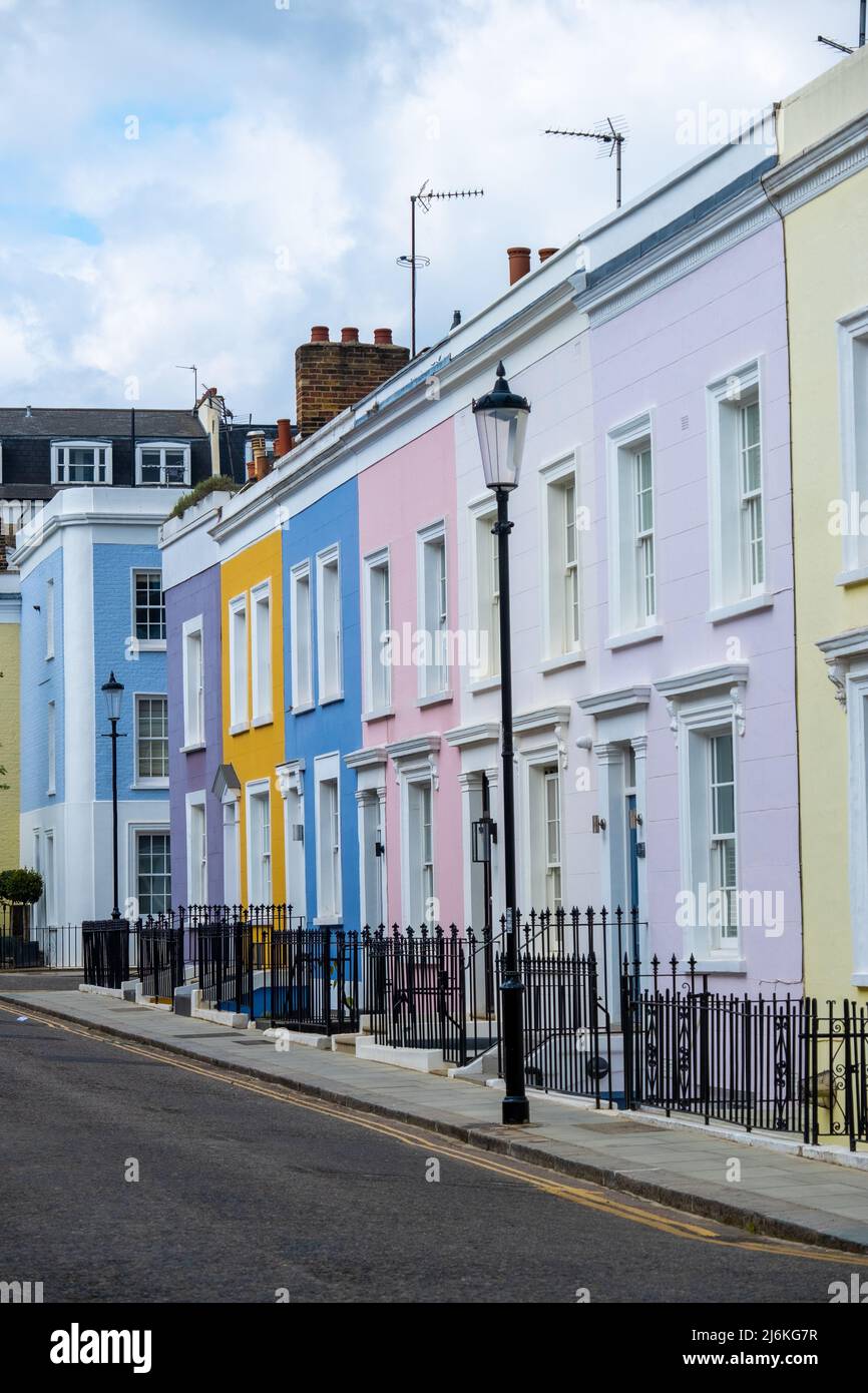 London -April 2022: Colourful street of upmarket townhouses in Notting Hill area of West London Stock Photo