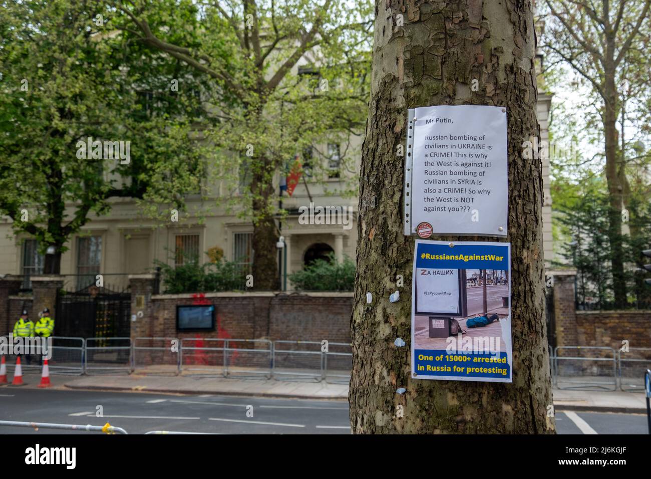 London- April 2022: Poster left by protesters outside the Russian Embassy in Kensington Stock Photo