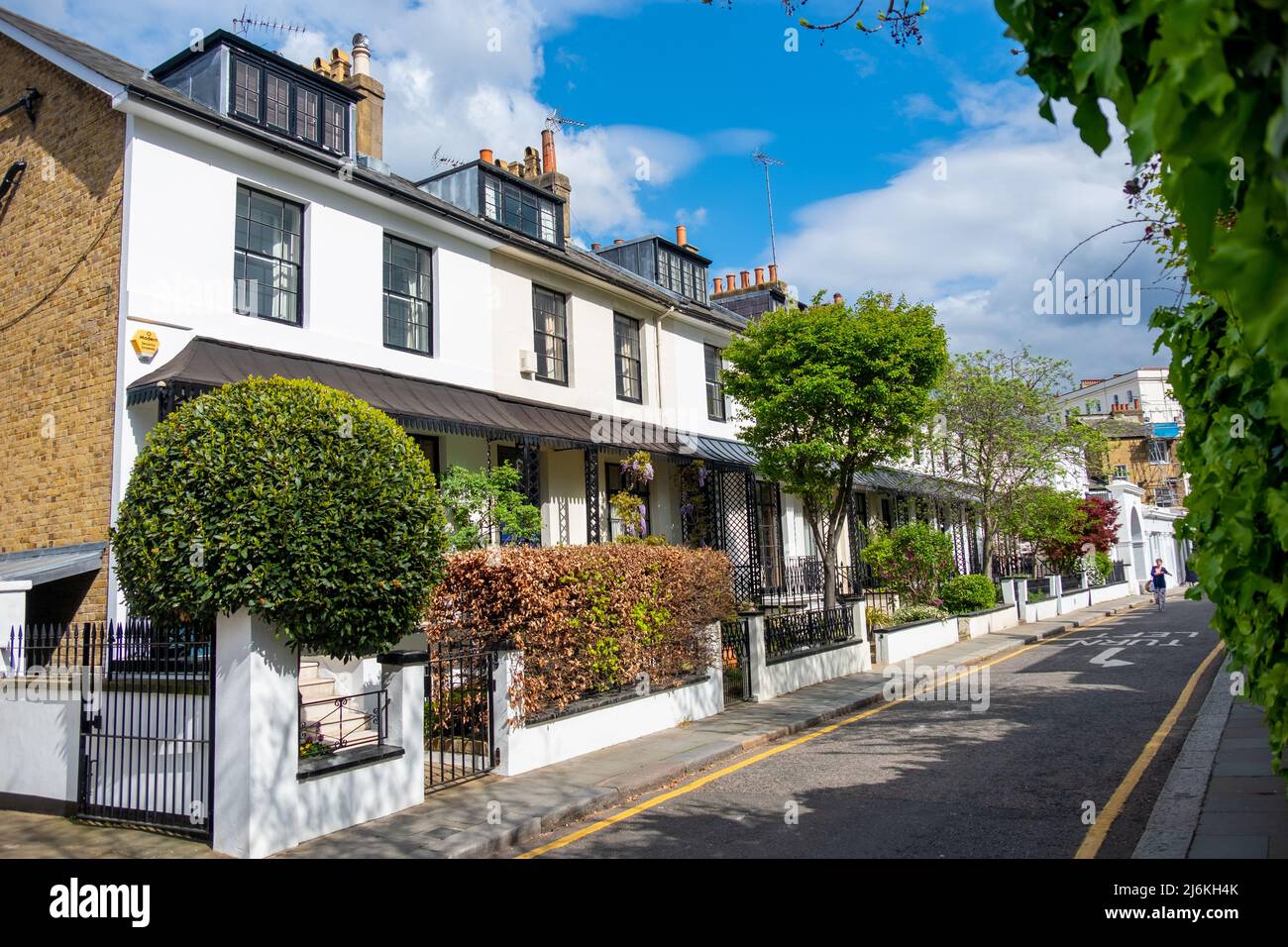 London, April 2022: Upmarket street of houses in Kensington Stock Photo