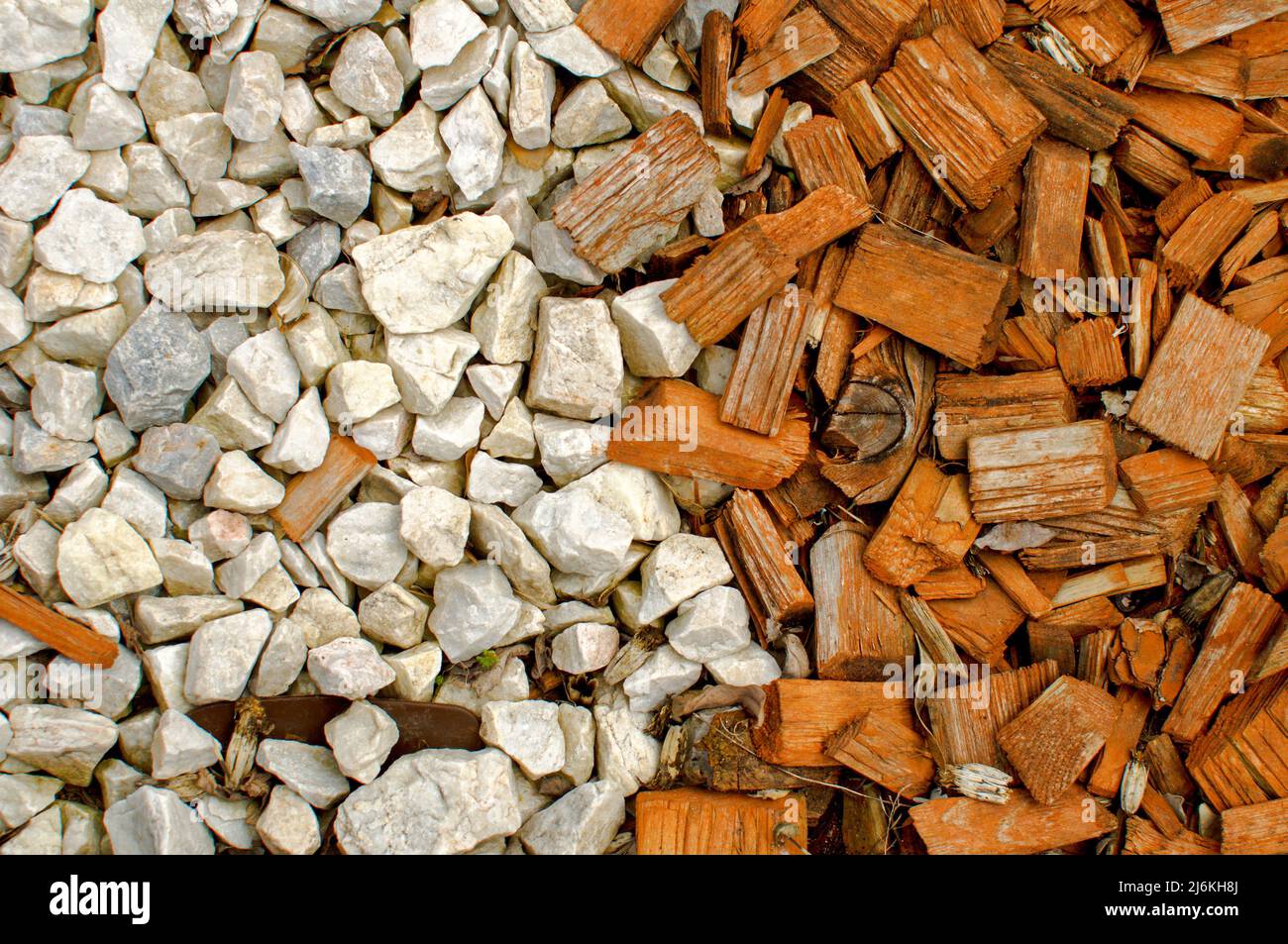 Texture of white stones and small pieces of colored wood, flat layout, wallpaper for various projects Stock Photo