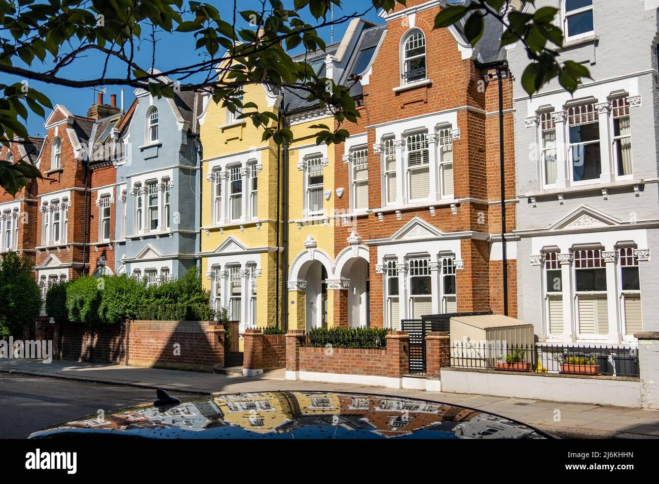 London- April 2022: An attractive street of period brick terraced houses in Shepherds Bush, Kensington area of west London Stock Photo
