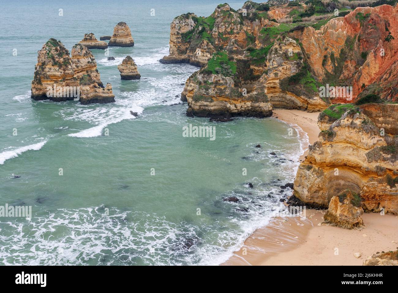 Islets and cliffs at Camilo beach, Lagos, Algarve, Portugal Stock Photo