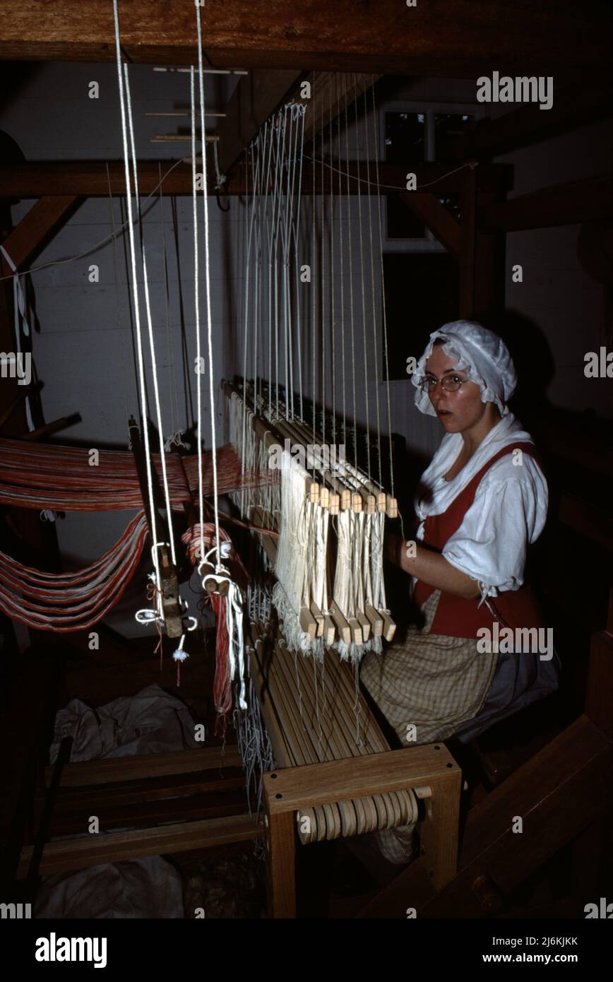 Williamsburg, VA. U.S.A. 9/1987. Colonial loom and spinning wheel