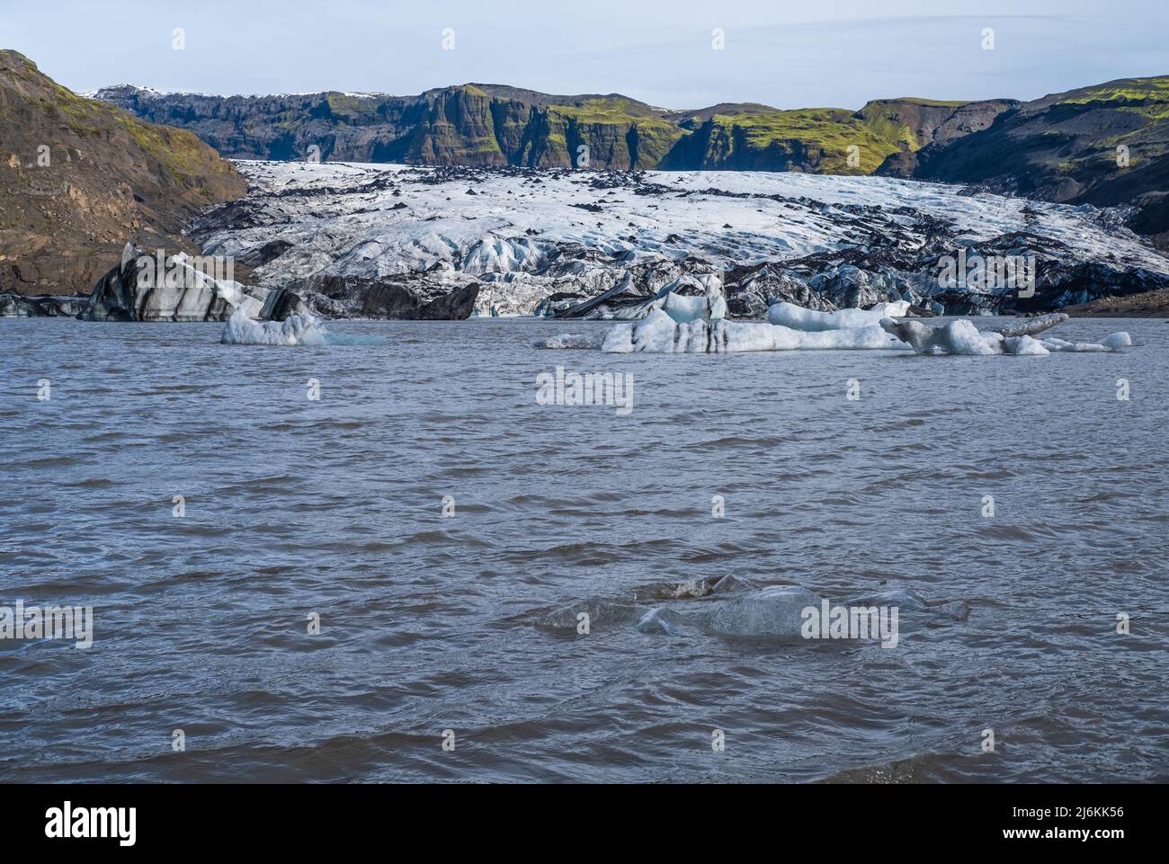 Solheimajokull glacier in southern Iceland. The tongue of this glacier slides from the volcano Katla. Beautiful glacial lake lagoon with ice blocks an Stock Photo