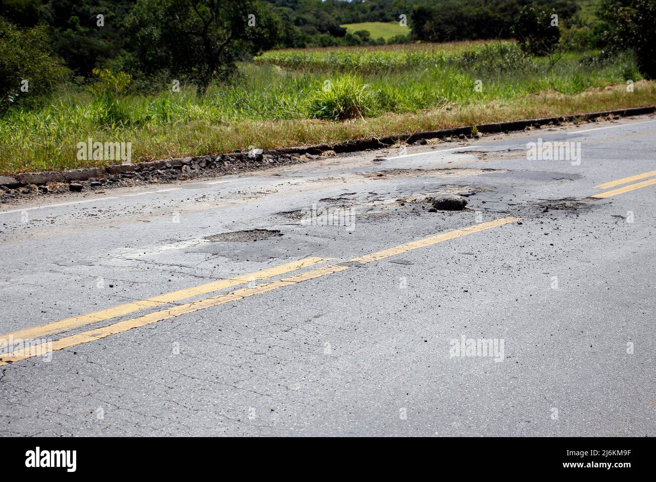 highway roof with defective and spoiled asphalt, dangerous for traffic Stock Photo