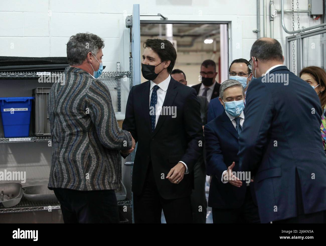 Canada's Prime Minister Justin Trudeau is greeted by  Stellantis COO for North America Mark Stewart at the Stellantis Research and Development Center in Windsor, Ontario, Canada May 2, 2022.  REUTERS/Rebecca Cook Stock Photo