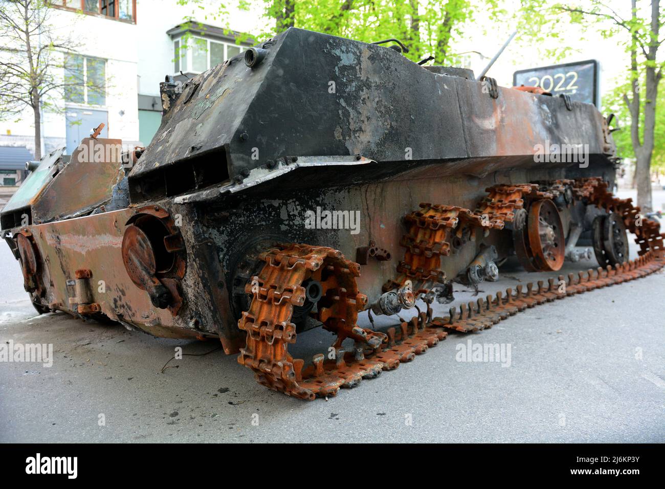 Kyiv region, Ukraine - 02 May 2022, A destroyed Russian tank parked on the roadside, it was destroyed by the Ukrainian military in the Kiev region. Russia invaded Ukraine on 24 February 2022, triggering the largest military attack in Europe since World War II. Stock Photo