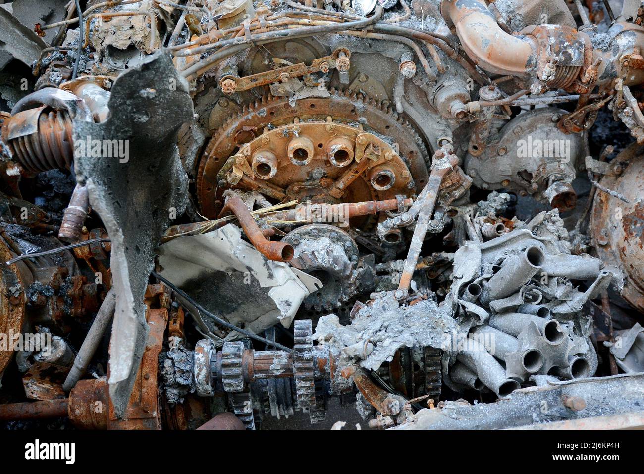 Kyiv region, Ukraine - 02 May 2022, Close-up of the engine of a destroyed Russian tank parked on the roadside, it was destroyed by the Ukrainian military in the Kiev region. Russia invaded Ukraine on 24 February 2022, triggering the largest military attack in Europe since World War II. Stock Photo