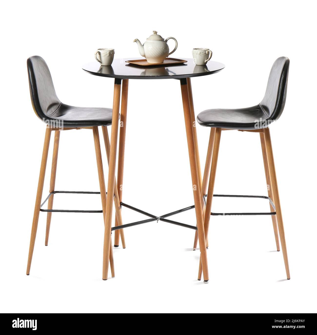 High chairs with table, teapot and cups on white background Stock Photo Alamy