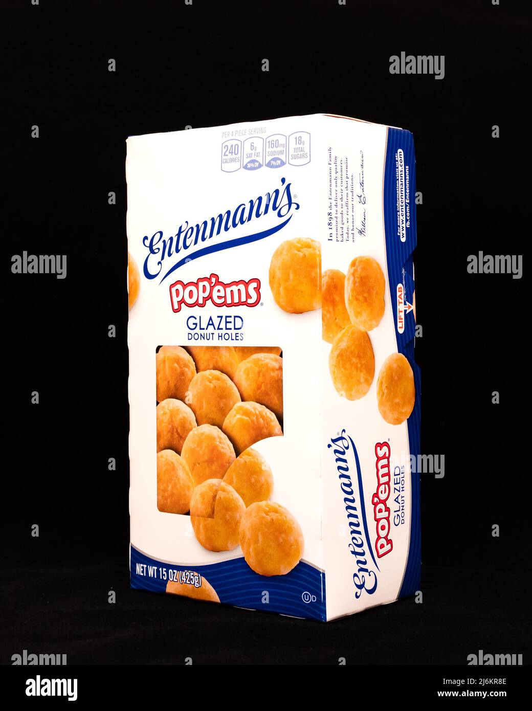 A box of Entenmann's glazed PoP'ems donut holes, with a soft yellow cake center isolated on black Stock Photo