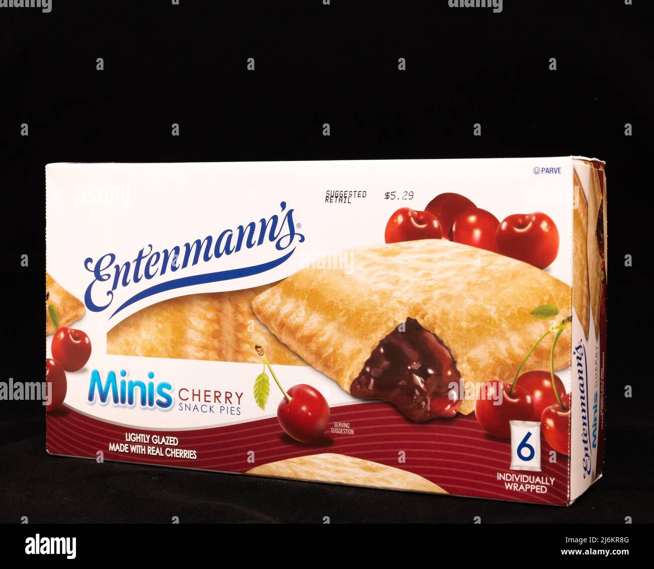 A box of Entenmann's Minis, individually wrapped cherry snack pies, lightly glazed and made with real cherries, isolated on black Stock Photo