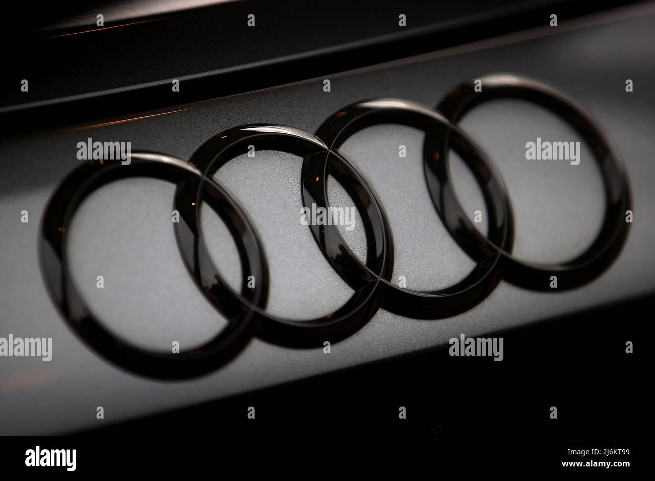 Logo of Audi seen on a new e-tron GT Audi car. Stock Photo