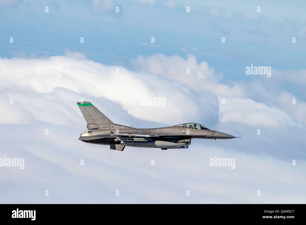 A U.S. Air Force F-16 Fighting Falcon, assigned to the Ohio National Guard’s 180th Fighter Wing, flies over the skies of Northwestern Ohio during a test of the Aerospace Control Alert System, April 27, 2022. The purpose of the event is to exercise coordination between the Eastern Air Defense Sector, Federal Aviation Administration and the 180FW, maintaining air sovereignty and air defense through the surveillance and control of airspace over Canada and the U.S.  (U.S. Air National Guard Photo by Staff Sgt. Kregg York) Stock Photo
