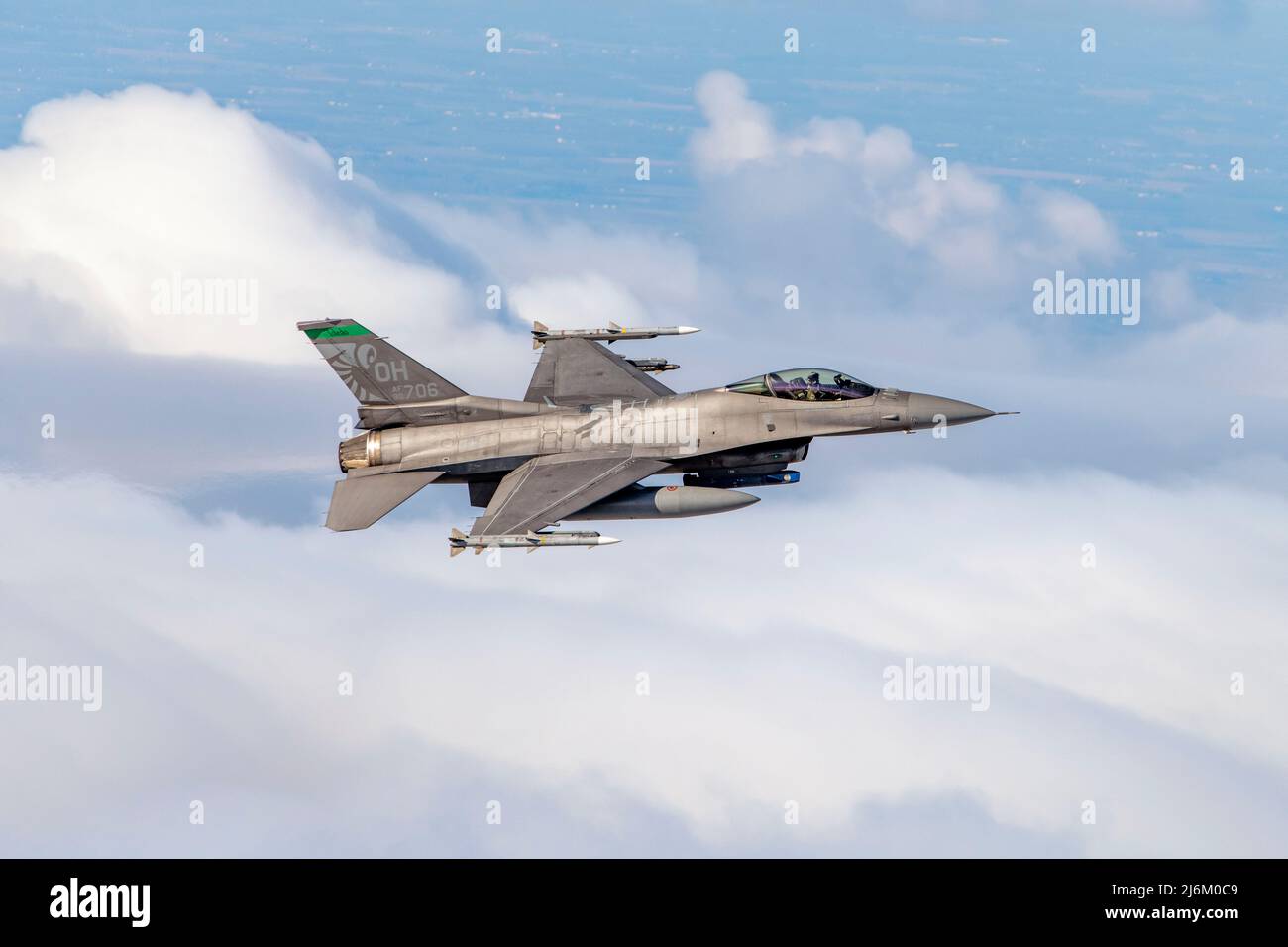 A U.S. Air Force F-16 Fighting Falcon, assigned to the Ohio National Guard’s 180th Fighter Wing, flies over the skies of Northwestern Ohio during a test of the Aerospace Control Alert System, April 27, 2022. The purpose of the event is to exercise coordination between the Eastern Air Defense Sector, Federal Aviation Administration and the 180FW, maintaining air sovereignty and air defense through the surveillance and control of airspace over Canada and the U.S.  (U.S. Air National Guard Photo by Staff Sgt. Kregg York) Stock Photo
