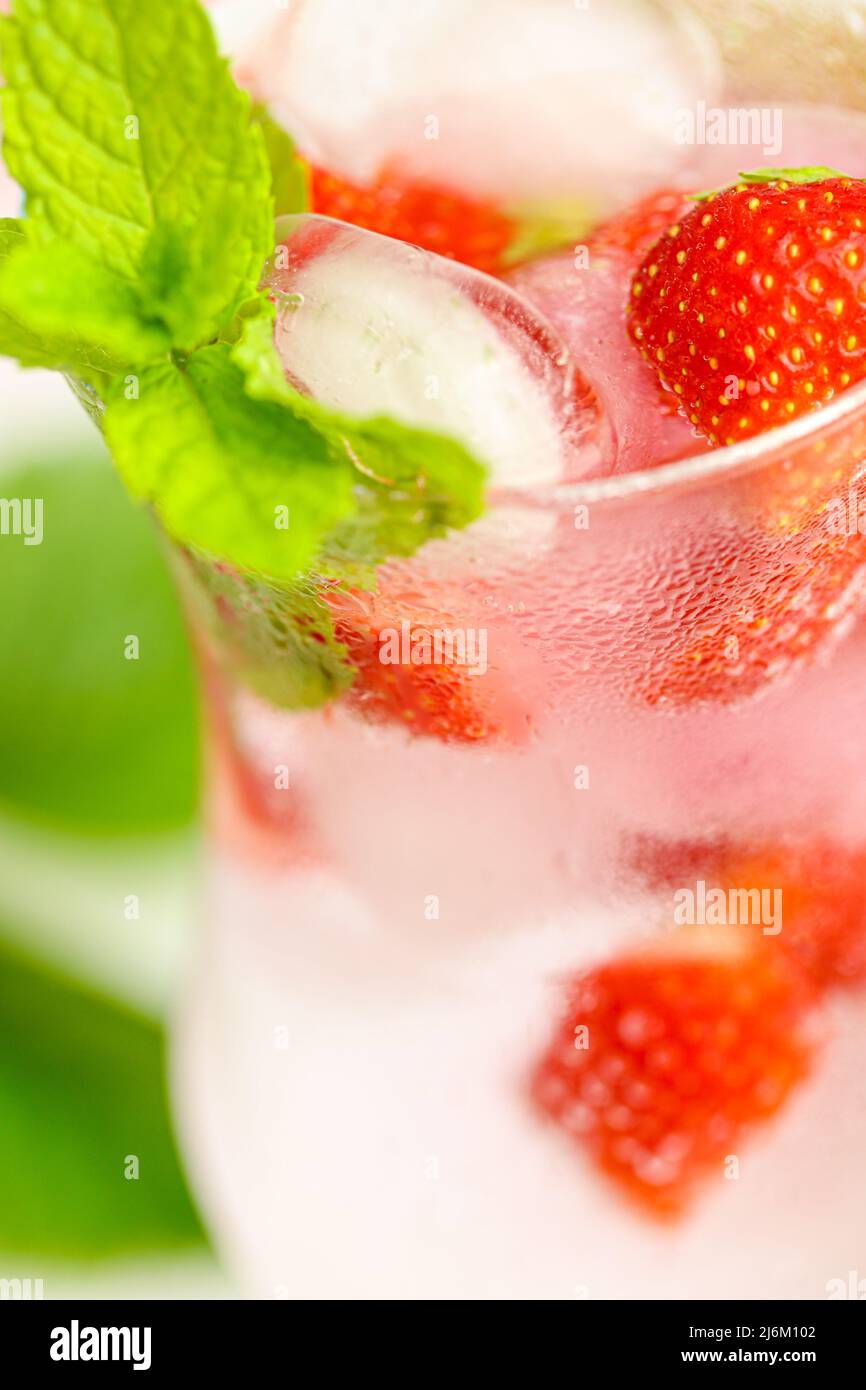 Strawberry drink.Refreshing cocktail. water in glass with ice and ...