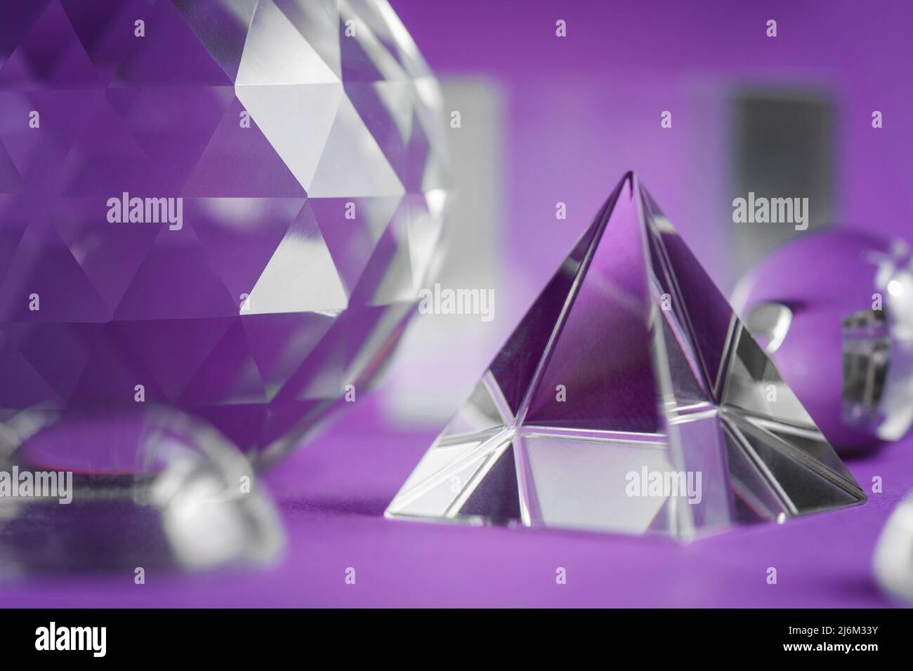 Crystal prism refracting light, magic crystals and pyramid, sphere and