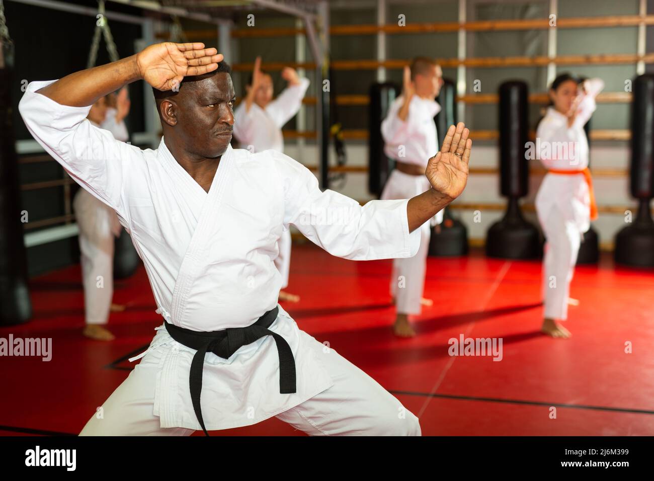 A Man, In A Black Kimono Is Practicing Martial Arts Technique With A Long  Bamboo Fighting Stick. Stock Photo, Picture and Royalty Free Image. Image  91980191.