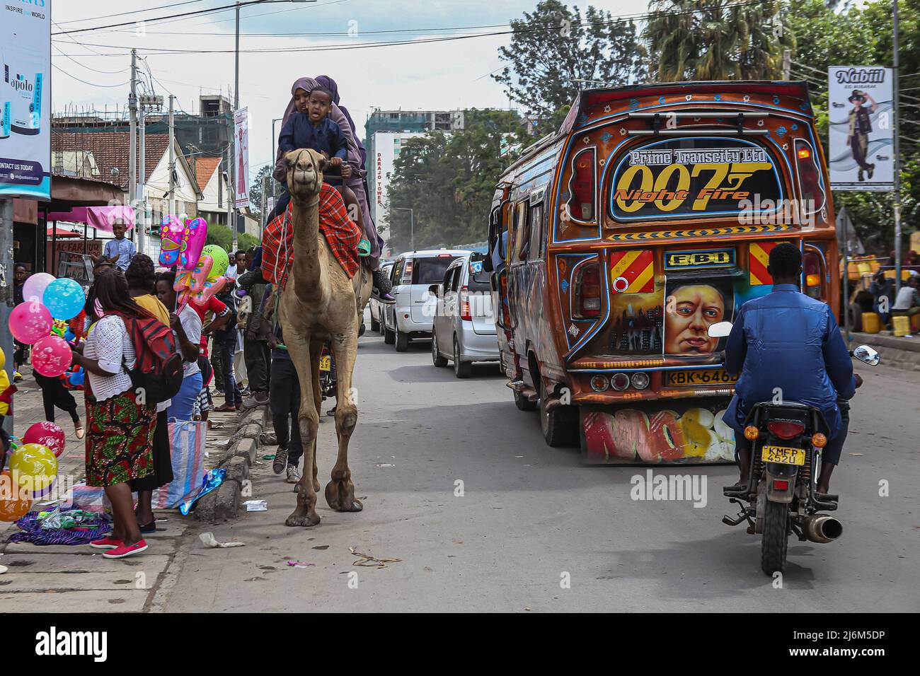 Kenyan Somali children enjoy a Carmel ride along Muratina road Eastleigh, during Eid-Ul-Fitr celebrations. Muslims in Kenya celebrate Eid-Ul-Fitr which marks the end of the Holy month of Ramadhan. Stock Photo