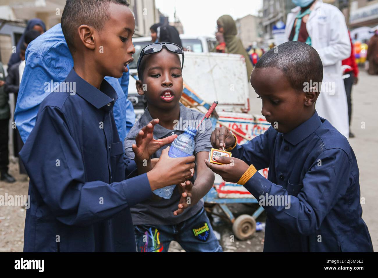 Kenyan Somali children light up fireworks at Jackson Muriethi street in Eastleigh, during Eid-Ul-Fitr celebrations. Muslims in Kenya celebrate Eid-Ul-Fitr which marks the end of the Holy month of Ramadhan. Stock Photo