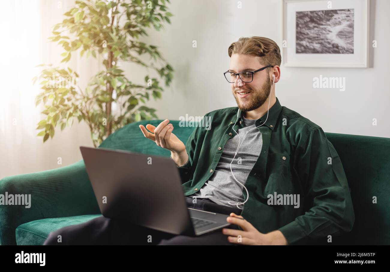 Man having video call at home Stock Photo