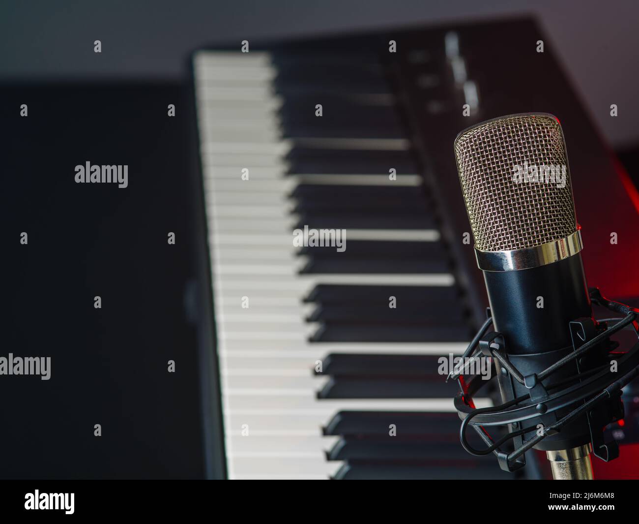 Recording studio. Synthesizer, midi keyboard and microphone. Minimalism