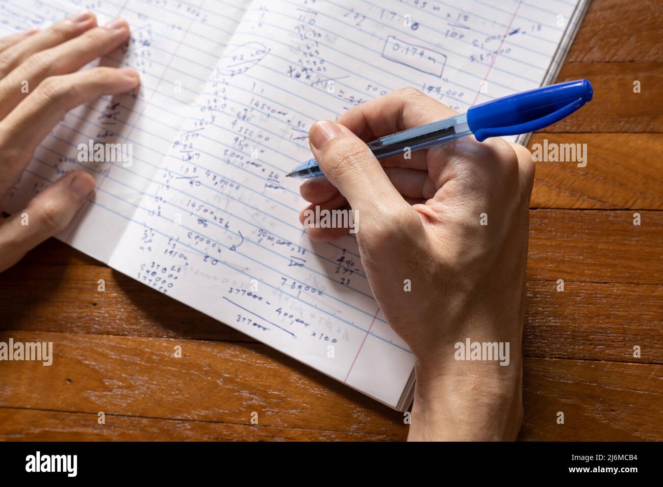 Do math on note paper Stock Photo