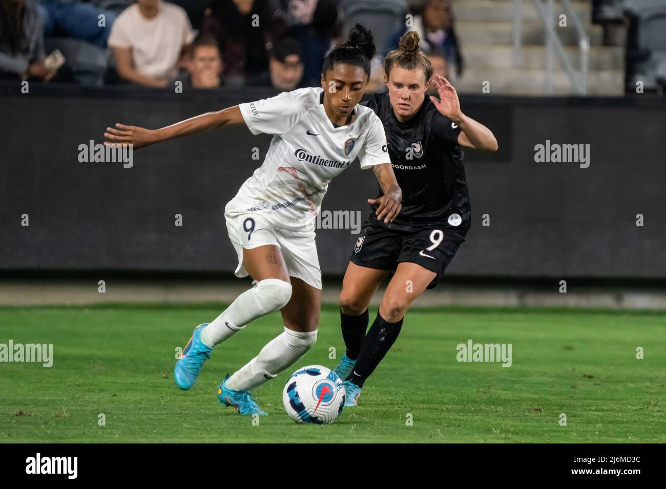 North Carolina Courage midfielder Kerolin Nicoli (9) is defended by Angel City FC midfielder Savannah McCaskill (9) during a NWSL match, Friday, April Stock Photo