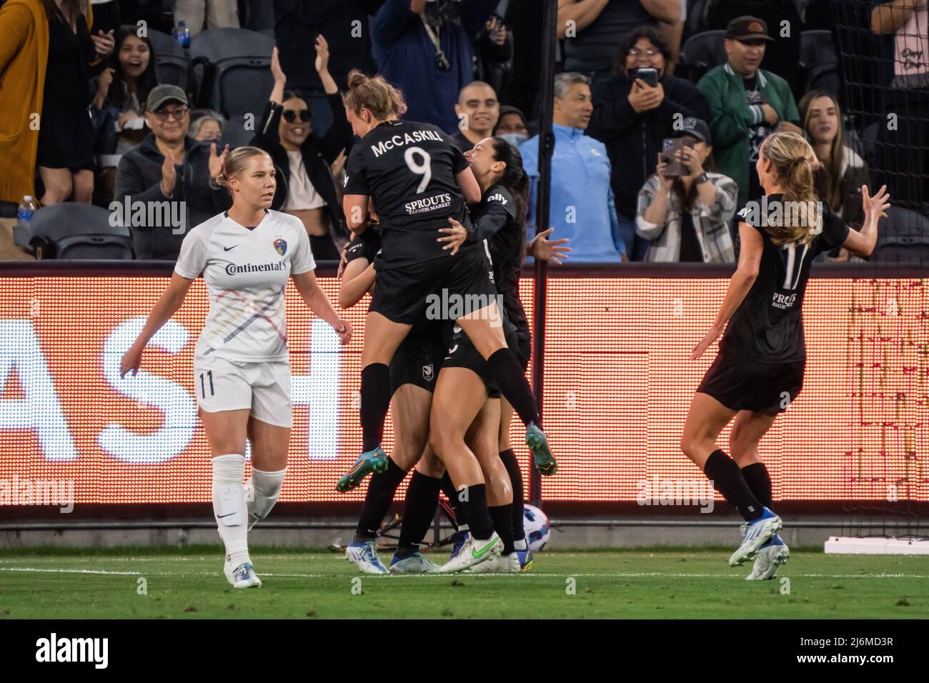 Angel City FC midfielder Savannah McCaskill (9) celebrates with teammates after a goal was scored during a NWSL match against the North Carolina Coura Stock Photo