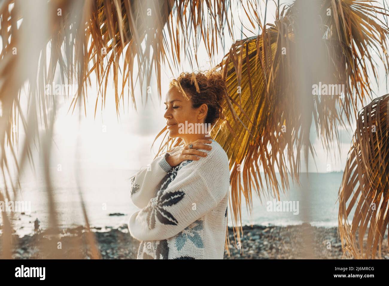 Balanced adult woman enjoying nature outdoors feeling hugging ...