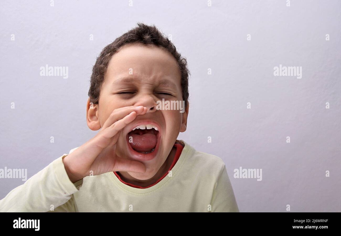 boy shouting with open mouth with people stock image stock photo Stock Photo