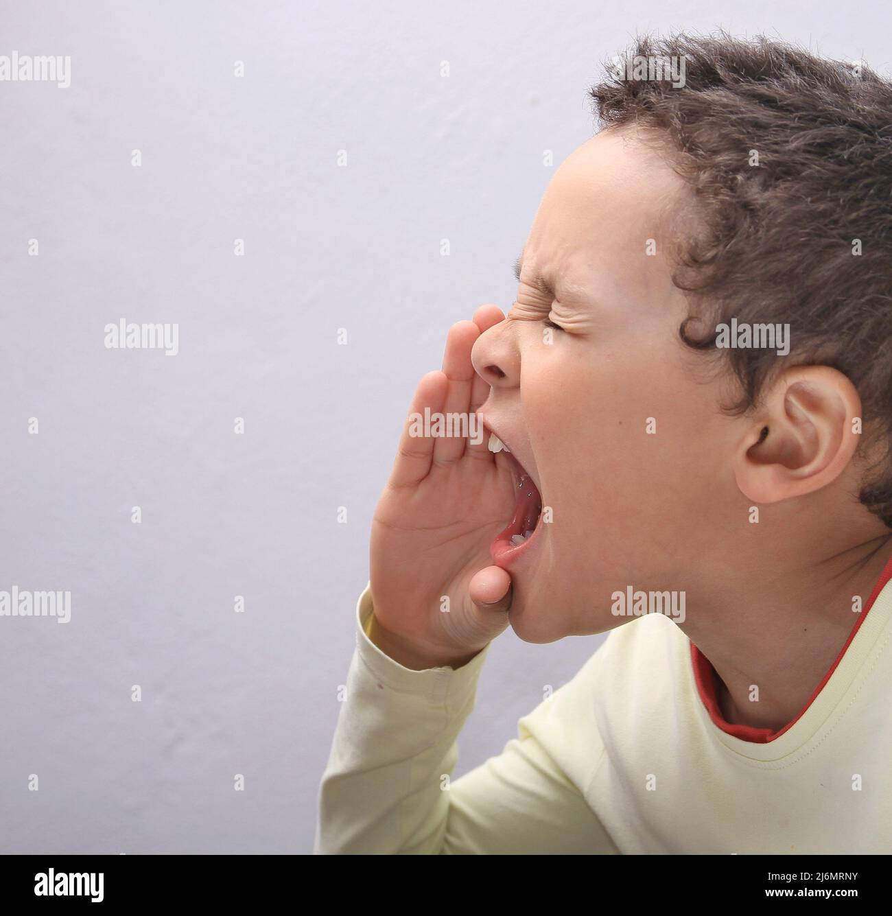 boy shouting with open mouth with people stock image stock photo Stock Photo