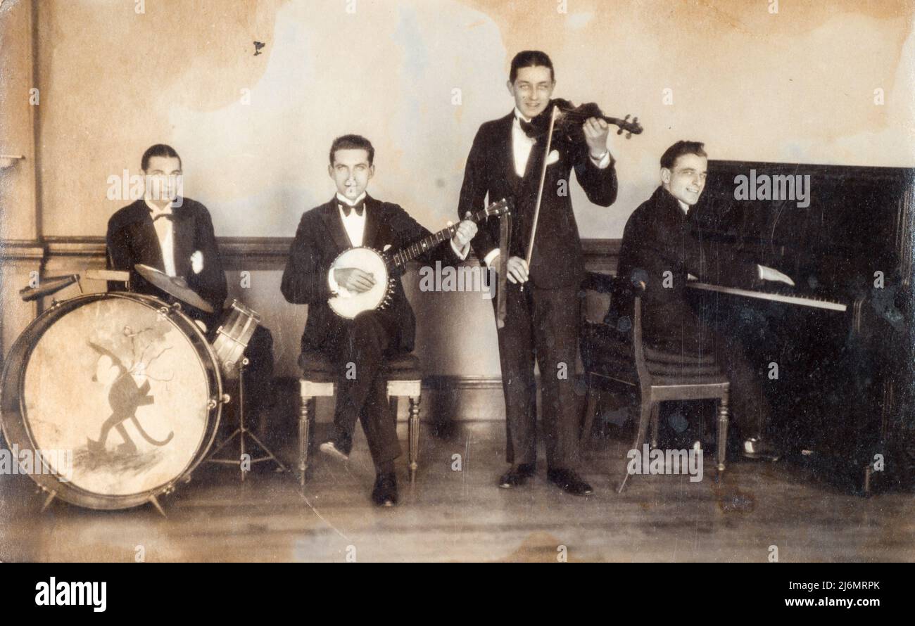 Archival sepia toned photograph of 'Felix Dance Orchestra' jazz band, 1927, England. On the bass drum, a painting of Felix the Cat Stock Photo