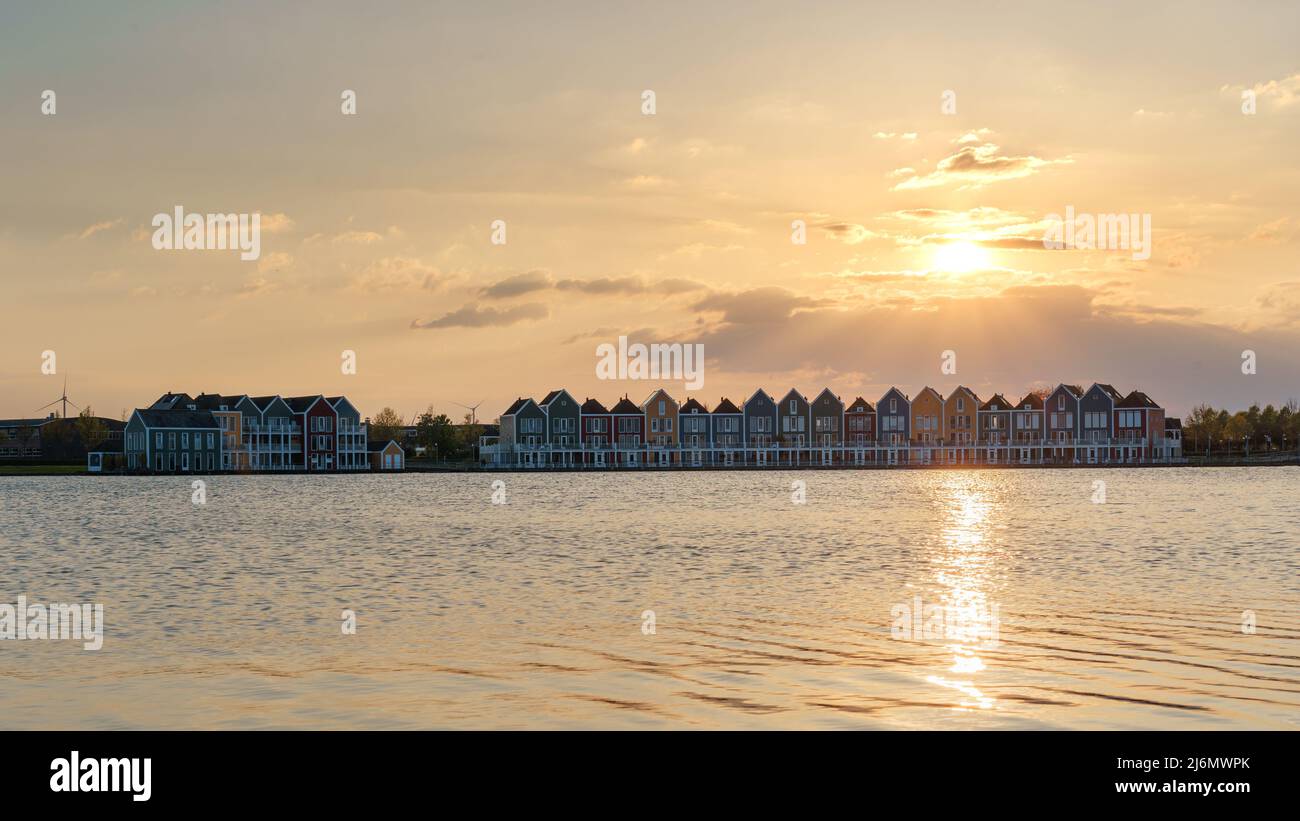 Colorful houses beside the lake at dusk in Houten, Utrecht, Nehterlands Stock Photo