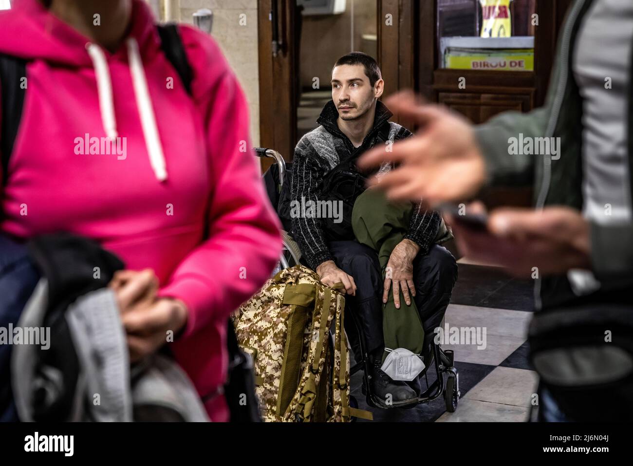 Disabled refugee from Ukraine Dimitrie leave the Moldovan capital Chisinau. From here, the NGO 'Be an Angle' from Berlin organises the onward journey of the refugees by bus to Germany. Stock Photo