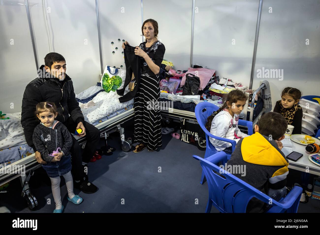 Refugee family of Arthur Dana from Nikolayev Ukraine living in the refugee camp at Moldexpo Exhibition Centre, Chisinau, Moldova after their escape. Stock Photo