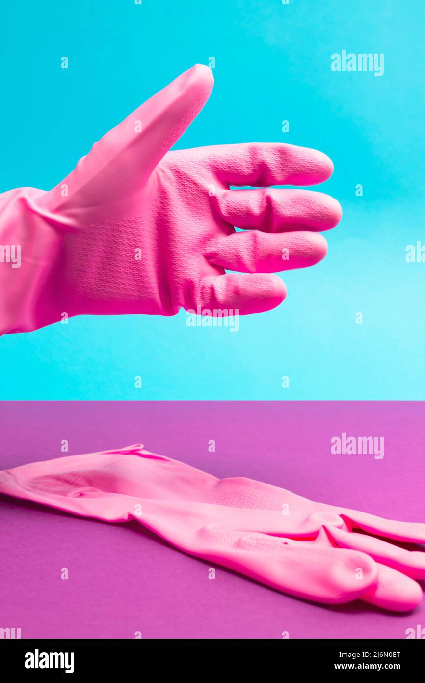 Hand in Pink latex glove in position for shaking. Hand shake. Cleaning and health concept. Stock Photo