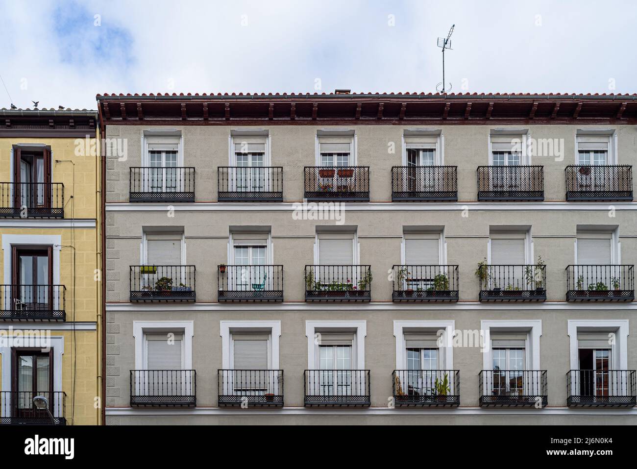 Low angle view of old residential buildings in Lavapies neighborhood in central Madrid. Stock Photo