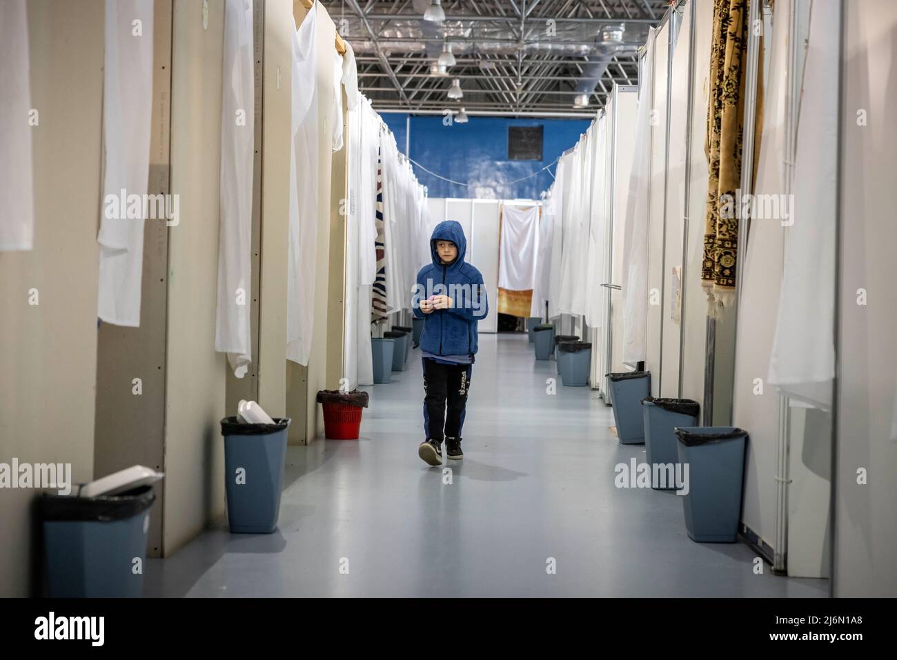 Everyday life after fleeing Ukraine in the refugee camp at Moldexpo Exhibition Centre, Chisinau, Moldova. Stock Photo